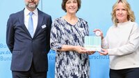 University President with Paper Atlas Representative and Federal Minister